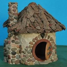 a small house made out of rocks with a door