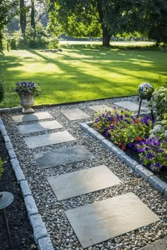 a garden with flowers and rocks in it