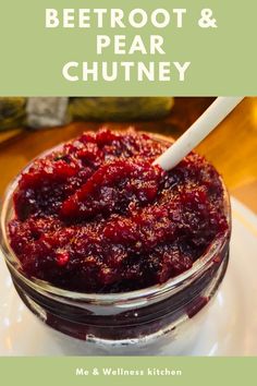 a bowl filled with cranberry sauce on top of a white plate