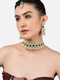 This jewellery set consists of a necklace, a pair of earrings and a maang tika Gold-plated chocker necklace has green and white kundan-studded and pearl beaded details Secured with a drawstring closure A pair of matching drop earrings, each secured with a post-and-back closure A matching maang tika, secured with hook closure Size & Fit Necklace length: 35 cm Earring length: 7 cm Ring diameter: 13 cm Material & Care Material: Alloy Plating: Gold-plated Stone type: Kundan and pearls Care Instruction Wipe your jewellery with a soft cloth after every use Always store your jewellery in a flat box to avoid accidental scratches Keep sprays and perfumes away from your jewellery Do not soak your jewellery in water Clean your jewellery using a soft brush, dipped in jewellery cleaning solution only D Green Kundan Choker Necklace, Traditional Green Metal Jewelry Sets, Green Jewelry For Eid, Festive Green Metal Jewelry Sets, Festive Beaded Metal Jewelry, Green Choker For Diwali Party, Green Choker For Diwali Celebration, Green Choker For Festive Season, Festive Green Choker Jewelry