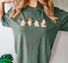 ORDER BY DECEMBER 10TH TO ENSURE CHRISTMAS DELIVERY.  ORDERS WILL STILL BE ACCEPTED AFTER THIS DATE, AND WILL BE PROCESSED AS SOON AS POSSIBLE, BUT MAY NOT ARRIVE BEFORE CHRISTMAS DAY.  PLEASE PLAN ACCORDINGLY AS REFUNDS WILL NOT BE PROVIDED FOR ORDERS THAT ARE DELIVERED WITHIN THIER ESTIMATED WINDOW.   This CUTE SHEET GHOST Comfort Colors® Shirt is perfect for this Halloween's spooky season!  We love the minimalist design that is sure to stay on-trend for years to come.  Wear to all of your Hal Halloween Apparel, Spooky Printed Tops For Halloween, Spooky Screen Print Tops For Fall, Spooky Fall Tops With Screen Print, Trendy Halloween Short Sleeve T-shirt, Retro Halloween T-shirt With Screen Print, Screen Printing Techniques, Sheet Ghost, Retro Halloween Cotton T-shirt