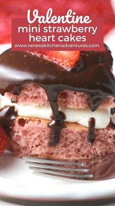 valentine's mini strawberry heart cakes on a white plate with chocolate drizzle and strawberries