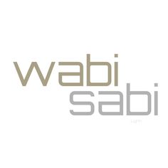 the words wabi sabi are in grey and white letters on a white background