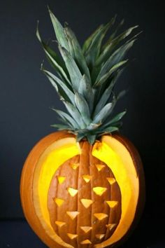 a carved pumpkin with a pineapple on top