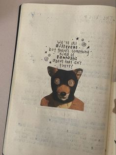 an open notebook with a drawing of a bear in it's face and words on the page