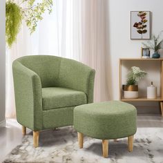 a green chair and ottoman in a living room