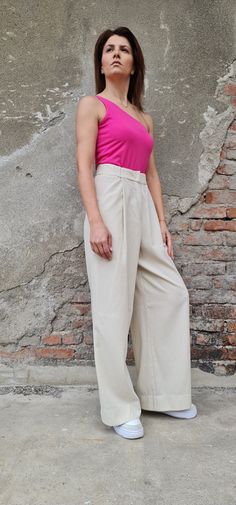 "This wide leg linen pants are perfect fit for the warm months of the year. The men style trousers has two side pockets and hook fly closer. On the back, there are two decorative pockets. ✥ Welcome to my world! I create my design in my dreams and I draw geometric lines and extravagant patterns with scissors, needles and thread. Be my dream catcher and let me create for you a parallel fashion world! ✥ SHIPPING Express shipping: 2-3 biz days via DHL Worldwide ✥ SIZING The model in the picture wear Beige Trousers For Summer Work, Beige High-waisted Cotton Dress Pants, Beige Summer Work Trousers, Beige Cotton Wide Leg Full-length Pants, Solid Linen Pants For Workwear, Beige Cotton Wide Leg Full Length Pants, Flax Wide-leg Pants For Workwear, Beige Cotton Full Length Wide Leg Pants, Flax Color Wide Leg Workwear Bottoms