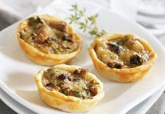 three mini quiches on a white plate