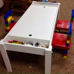 a child's table and chairs made out of legos