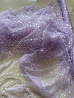 We offer a variety of fashion handmade fabric，those are widely use for wedding dress，garment and fashion cloth. we sell it by yard，our minimum order is 1 yards，and we always package it 15 yards for one roll，the width is 130cm/50 inch Material ： mesh ，Rayon,polyester. Symmetrical embroidery floral pattern, with lovely flowers in the middle, scalloped border. You can also cut and use separately. Perfect for dress, tops, wedding veil. You can split the piece up and have one scalloped edge around th Sheer Organza Tulle Fabric For Party, Purple Tulle Fabric For Spring Wedding, Purple Organza Tulle Fabric For Wedding, Spring Wedding Purple Tulle Fabric, Sheer Summer Tulle Fabric Made Of Net, Lavender Tulle Fabric For Wedding, Purple Lace Tulle Fabric For Party, Purple Lace Tulle Fabric For Wedding, Purple Tulle Fabric For Party