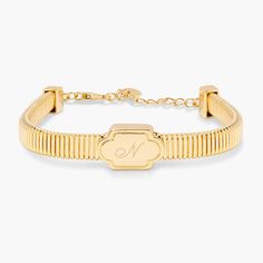 The Harlow Bracelet is the perfect accessory for everyday accessorizing — the deco plaque and flexible ribbed bracelet make this the ultimate luxe accessory. And with the added bonus of custom engraving, you can wear a piece that's unique to you! Available in 14k gold plated brass Pendant size: 3/4" by 1/2" Width: 6mm 6.5" flexible ribbed omega chain with 1" extender Protected with an anti-tarnish barrier With engraving this item is FINAL SALE SKU: BYB1246 Elegant Adjustable Jewelry With Engraving Option, Classic Engraved Adjustable Gold Bracelet, Elegant Adjustable Name Bracelet With Engraving Option, Adjustable Elegant Name Bracelet With Engraving Option, Timeless Adjustable Rectangular Bracelet, Timeless Adjustable Rectangular Bracelets, Classic Adjustable Bracelets With Rectangular Links, Luxury Adjustable Gold Bracelet With Engraving, Luxury Adjustable Engraved Gold Bracelet