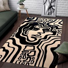 a black and white area rug with an abstract woman's face on the floor