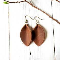 "These beautiful brown leather petal earrings are simple & sweet. The leather has been pinched into a petal shape making these lightweight earrings an everyday go-to. Made from crazy horse leather, each pair of earrings will have their own \"look\" and may include natural markings characteristic of this leather. Rubber earring backs are included and encouraged to be worn with these earrings so you don't lose one. Leather is amazing and has a lot of neat things about it, BUT it doesn't swim. Handmade Brown Leather Earrings, Leather Leaf Earrings, Leaf-shaped Brown Earrings Gift, Brown Leather Minimalist Earrings, Brown Leather Dangle Earrings, Leather Leaf, Boho Macrame, Boho Leather, Macrame Earrings