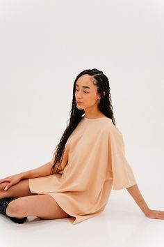 Our oversized t-shirt dress is the perfect cozy/casual dress. You can wear it by itself as a dress or with our V Cute Leather Pants as an oversized tee. Color: Peach Care: Delicate wash cold, lay flat to dry. 25” from the neck to the bottom front 30.5” from neck to bottom of back based on size small Material: 100% Cotton Spring Oversized Beige T-shirt, Trendy Oversized Crew Neck T-shirt Dress, Trendy Oversized T-shirt Dress With Crew Neck, Oversized Crew Neck T-shirt Dress For Summer, Oversized Effortless T-shirt For Fall, Summer Lounging T-shirt With Short Sleeves, Oversized Crew Neck T-shirt Dress For Spring, Relaxed Oversized Spring T-shirt, Oversized Casual T-shirt For Daywear