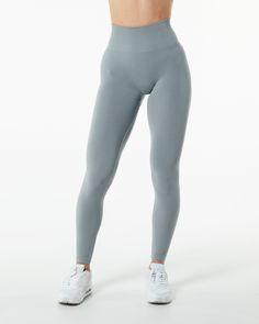 Amplify Legging - Utility Grey – Alphalete Athletics Functional Tight Seamless Leggings, Functional Fitted Solid Leggings, Fitted Functional Solid Color Leggings, Functional Fitted Solid Color Leggings, Functional Fitted Leggings With Seamless Construction, Functional Seamless Tight Tights, Solid Snug Fit Sportswear Leggings, Solid Snug Fit Leggings For Sportswear, Solid Color Snug Fit Sportswear Leggings