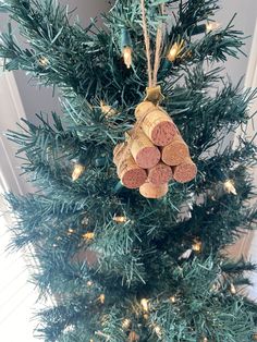 a christmas tree with wine corks hanging from it