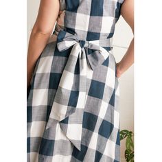 The Roberta Dress is an elegant midi-length style. The sleeveless design has a fitted waist tie and a gently fitted bodice. Both practical and pretty, it has concealed pockets and a neat zip finished with a keyhole closure to add a point of interest. Made in versatile indigo plaid, this dress looks at home in casual or more formal settings. Made from 100% cotton  Turn inside out and Machine wash at 30°C with similar colours  Do not tumble dry. Dry away from direct heat and sunlight  Cool iron on Portobello Market, Original Clothes, Whittling, Signature Print, Dress C, Plaid Dress, Independent Designers Fashion, Fitted Bodice, Waist Tie