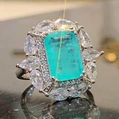 "925 Silver Exclusive Blue Emerald Cut Cubic Zirconia Ring, Fb16fa1064 Metal: 925 Sterling Silver Plated Stone: Cubic Zirconia Best Quality Available Ring Size: 6, 7, 8, 9 Gift For Women, Christmas, Birthday, Vacation, Mother's Day, Valentine's Day, Wedding, Engagement , Bridal, Promise, Anniversary, Party Thank You For Visitng!" Emerald Ring With Cubic Zirconia Center Stone, Dazzling Emerald Ring With Accent Stones, Silver Emerald Ring With Cubic Zirconia, Silver Emerald Ring With Cubic Zirconia Center Stone, Silver Emerald Ring For Party, Elegant Silver Aquamarine Crystal Ring, Dazzling Silver Aquamarine Rings, Dazzling Silver Aquamarine Jewelry, Elegant Turquoise Ring For Party