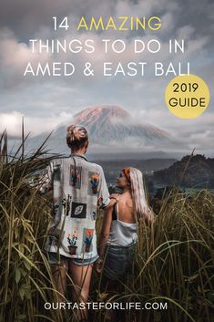 two people standing in tall grass with the words, bukit cinta bali & mount agung viewpoint guide