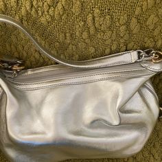 Brighton Silver Metallic Small Handbag. About 10” X 5”. Great Condition - Never Used. Comes With Dust Bag. Has Zipper Pocket Inside And 2 Open Pockets Inside. Beautiful Gold And Silver Accents Travel Clutch Shoulder Bag With Silver-tone Hardware, Everyday Use Satchel Baguette Bag With Silver-tone Hardware, Everyday Satchel Baguette Bag With Silver-tone Hardware, Shopping Shoulder Bag With Silver-tone Hardware, Travel Baguette Shoulder Bag With Silver-tone Hardware, Shoulder Bags With Silver-tone Hardware For Shopping, Daily Baguette Satchel Bag With Silver-tone Hardware, Daily Use Baguette Bag With Silver-tone Hardware, Everyday Use Clutch Shoulder Bag With Silver-tone Hardware