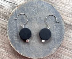 Matte black resin coin shaped dangle earrings to made to your specifications. These match our Charlotte necklace. We can make these earrings with any of our other Charlotte colors. The necklace is sold separately. You can choose between 1 or 2 beads. The wood and thinner acrylic Charlotte style will be lighter weight than these. 1 bead earrings 1.75" long2 bead earrings 2.75" long* Shepherds hook adds .25" to the length of the earrings Ear Wire options:- Gold Filled or Sterling Silver Shepherds Pearl Statement Necklace, Silver Jewelry Box, Long Beaded Necklace, Black Resin, Brooch Necklace, Beaded Statement Necklace, Gold Gift, Mens Beaded Bracelets, Multi Strand Necklace