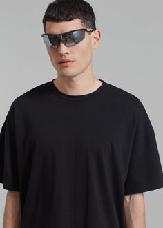 Color: Black Midweight t-shirt Boxy fit Crew neckline Drop shoulders Straight hem Unlined 100% Cotton Machine Wash Cold By The Frankie Shop. Imported Casual Boxy Black Cropped T-shirt, Black Boxy Cropped T-shirt, Casual Style, Modern Black T-shirt For Summer, Black Boxy Fit Casual Cropped T-shirt, Black Boxy Cropped T-shirt With Crew Neck, Modern Black T-shirt For Everyday, Modern Black Everyday T-shirt, Modern Boxy Fit Tops For Streetwear, Black Relaxed Fit Modern Tops