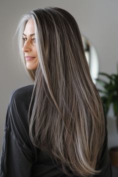 32 Stunning Long Hairstyles for Women Over 60 to Reinvent Yourself in – CreativeBooster Gray Highlights Light Brown Hair, Face Framing Silver Highlights, Dark Blonde Gray Hair Color Ideas, Brown Hair With Grey Highlights Silver, Long Layered Grey Hair, Dark Hair With Grey Balayage, Brown Hair With Gray Highlights, Growing Out Gray Hair Blending, Gray Hair Blue Eyes