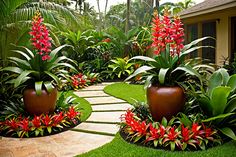 an outdoor garden with red flowers and green plants in the center, surrounded by greenery