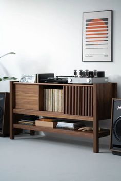 a record player and speakers in a room