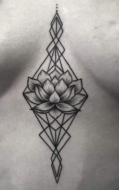 a woman's chest with a lotus tattoo on it