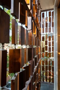 a wall made out of wooden blocks and metal bars