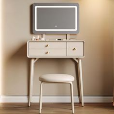 a white dressing table with a mirror and stool