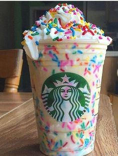 a starbucks drink with sprinkles and white frosting