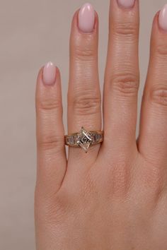 a woman's hand with a ring on it