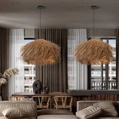 a living room filled with lots of furniture next to a tall window covered in curtains