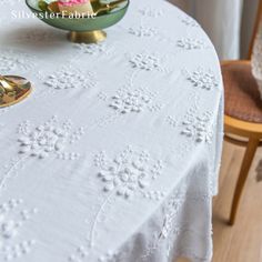 a table with a bowl of flowers on it