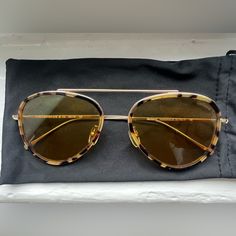 Great Condition! No Scratches Or Bends. Does Not Come With Original Box But I Will Provide Black Sunglasses Slip. Style: Dorchester Ace E - Tortoise/Gold - Honey Flat See Through Sunglasses Sharp Aviator Sunglasses With Tortoiseshell Frames And See Through Lenses. 100% Uv Protection Yellow Lenses Adjustable Nose Pads Acetate/Steel The Dorchester Ace Is The Same As The Dorchester Except That It Carries Acetate Around The Rim Of The Lenses. This Teardrop, Lightweight Wire Frame Is Our Take On The Modern Aviator. The Single Upper Bridge And The Filigree On The Temples Give A Contemporary Touch To This Pair. The Dorchester Suits Oval Faces Best, But Can Also Be Worn On Square-Shaped Faces Gold Aviator Sunglasses, Tortoise Color, Wire Frame, Oval Faces, Black Sunglasses, Aviator Sunglasses, Tortoise Shell, Brown Gold, Tortoise