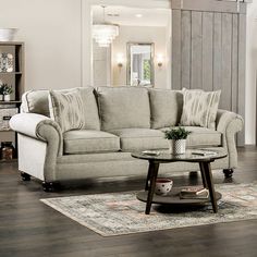 a living room scene with focus on the couch and coffee table in the center area