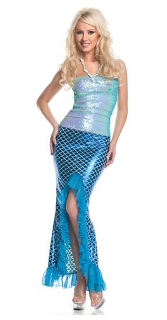 a woman in a mermaid costume posing for the camera with her hands on her hips