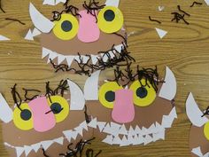 some paper plates with monster faces on them