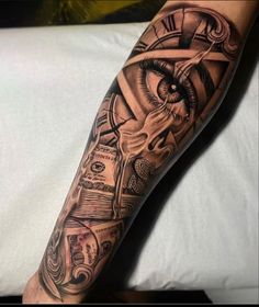 a man's arm with an all seeing eye and money tattoo on the forearm