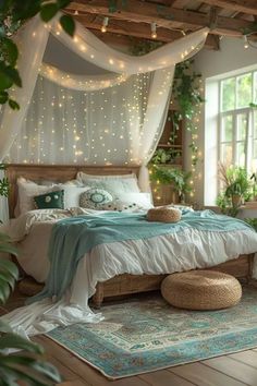 a bedroom decorated in white and green with fairy lights on the ceiling, bedding, rugs and pillows