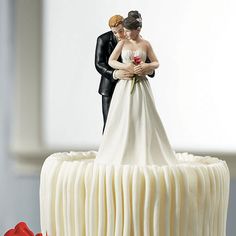 a wedding cake with a bride and groom figurine on top that says custom colors