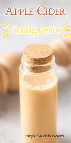 apple cider vinaigrette in a glass jar with a cork lid and text overlay