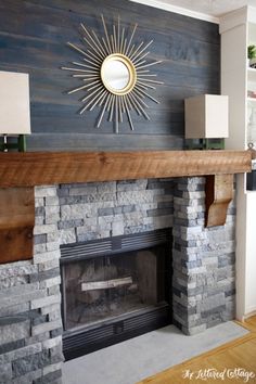 a fireplace with a mirror above it and a fire place on the wall next to it