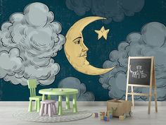 a child's room with a chalkboard and stars on the moon wallpaper