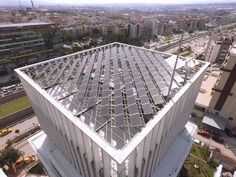 an aerial view of a large white building with lots of windows on it's side