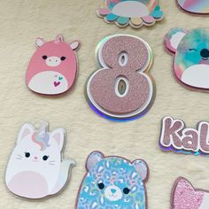 there are eight different animal shaped magnets on the table