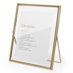 a gold frame with the words,'christine'written in white on it