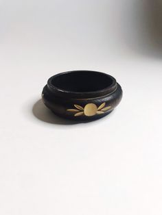 "Vintage Wooden Wide Bangle Wood Brown Floral Carved Bracelet 1980's 70s Boho Chunky Bangles Flower are carved out of the wood around the bracelet.  Condition:   Good vintage condition, a few scratches on the bracelet edge. Not to heavy; Light weight piece  Measurements   1.5\" width   10.5\" circumference ---------------------------------------------------------------- Please ask all questions before purchasing this item(s). International shipping available. All items shipped with care." Vintage Carved Bracelets For Ceremonial Occasions, Spiritual Carved Bangle Bracelets, Vintage Carved Jewelry For Ceremonial Occasion, Vintage Round Bracelets For Ceremonial Occasions, Vintage Carved Bracelet Jewelry, Vintage Carved Jewelry Bracelet, Vintage Ceremonial Bangle Bracelet, Collectible Carved Bangle Bracelets, Ceremonial Carved Bangle Bracelet